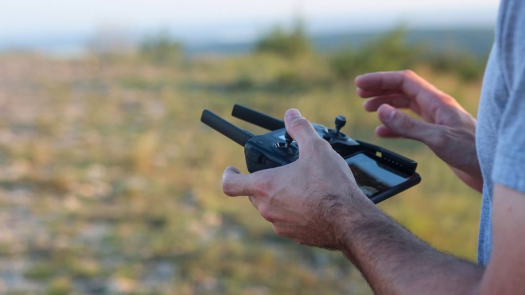 Close-up of hands-on drone controller training session at Drone Training Hub